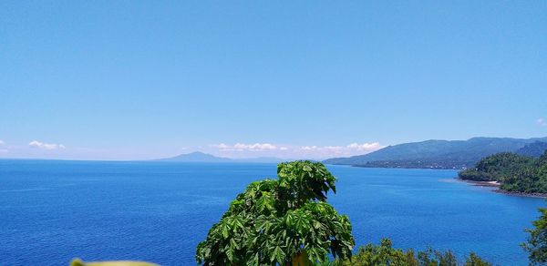 Scenic view of sea against clear blue sky