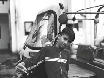 Full length portrait of young man standing outdoors