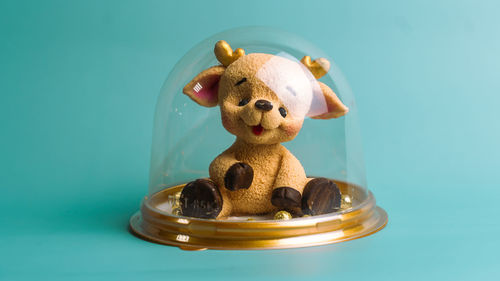 Close-up of stuffed toy against blue background