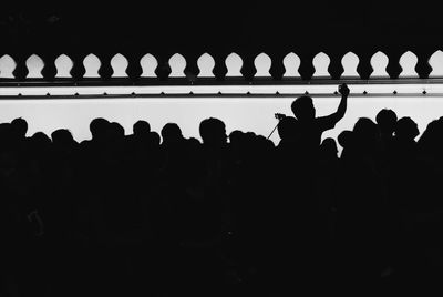 Silhouette group of people in row