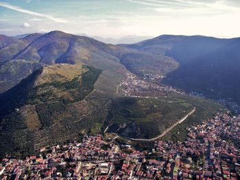 High angle view of townscape against mountains