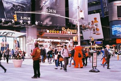 People walking on street in city