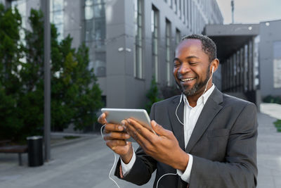 Young man using mobile phone