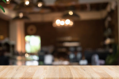 Defocused image of illuminated restaurant