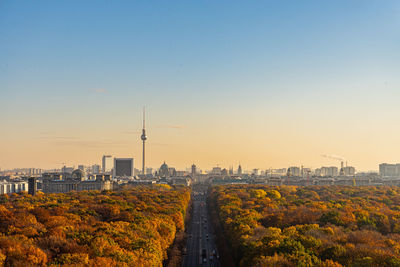Berlin city panorama with tiergarten against sky during sunset
