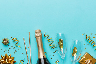 Close-up of christmas decorations on blue background