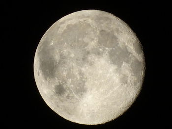 Low angle view of moon against clear sky at night