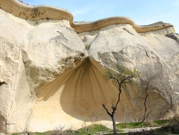 Panoramic view of rock formation on land against sky