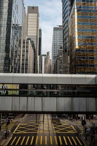 Bridge amidst buildings in city