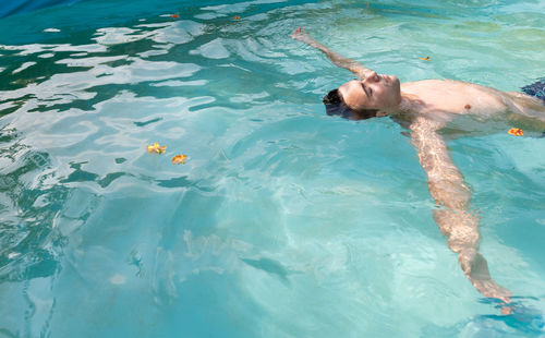 High angle view of man swimming in pool