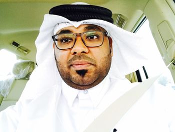 Close-up of man sitting in car