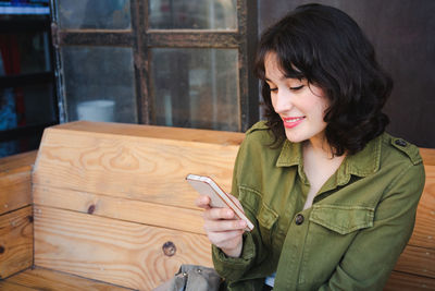 Young woman using mobile phone