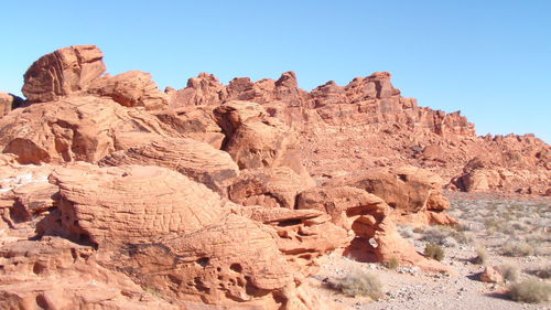 Scenic view of rocky mountains against clear sky