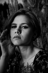 Close-up portrait of young woman looking away