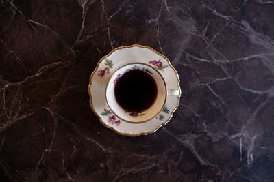 High angle view of coffee cup on table