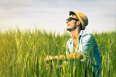 Man looking away on field