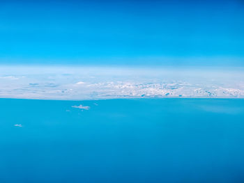 Scenic view of sea against blue sky