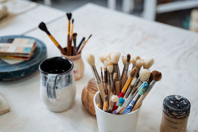 High angle view of paintbrushes on table