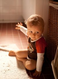 Portrait of cute girl sitting at home