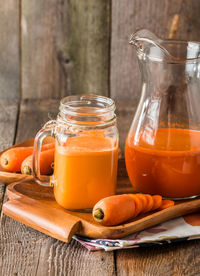 Close-up of beer in glass jar on table