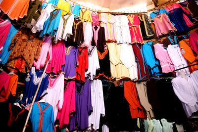 Multi colored umbrellas hanging at market stall