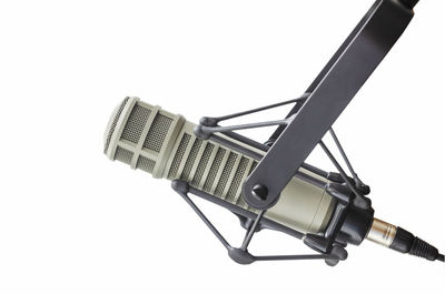 Close-up of communications tower against white background