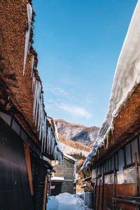 Panoramic view of buildings against sky during winter