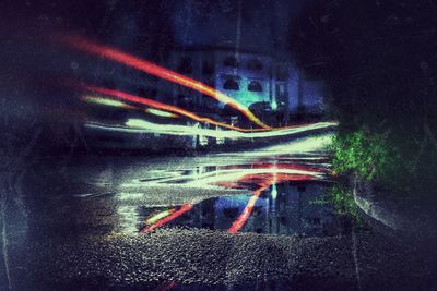 Digital composite image of light trails in city at night