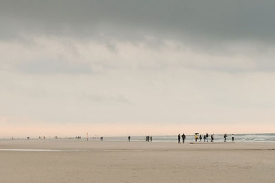 Scenic view of beach against sky during sunset