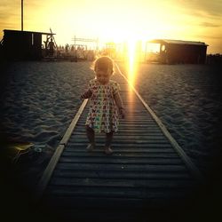 Silhouette of woman at sunset