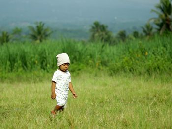 Full length of child standing on field