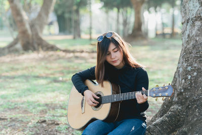 Young woman playing guitar