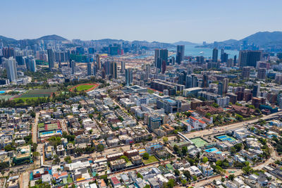 Aerial view of city buildings against sky