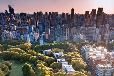 High angle view of buildings in city against sky