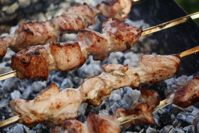 Close-up of meat on barbecue grill