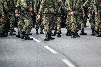 Army soldiers with rifle during parade