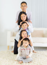 Portrait of smiling family at home