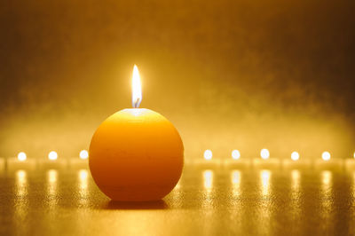 Close-up of illuminated candle