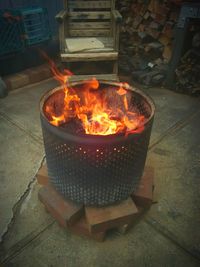 Burning candles on barbecue grill