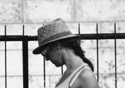 Side view of woman wearing hat outdoors