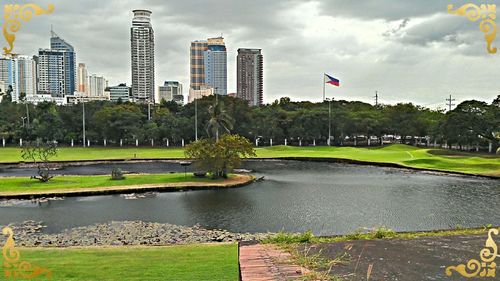 Low angle view of buildings against cloudy sky