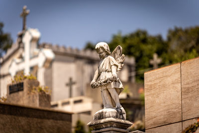 Low angle view of statue against sky