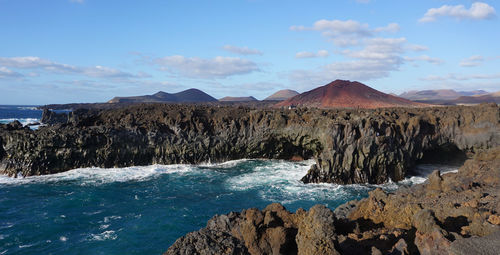 Scenic view of los hervideros against sky