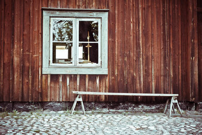 Empty chairs and chair by window