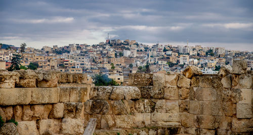 Buildings in city against sky