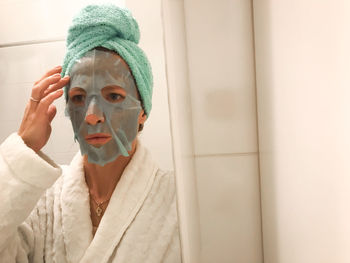 Portrait of woman in bathroom