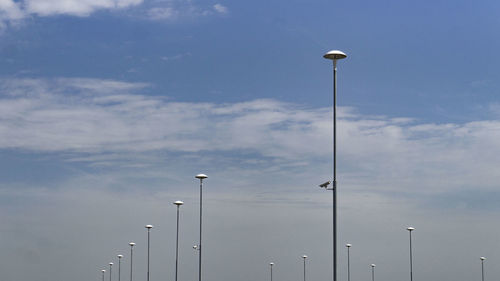 Low angle view of street light against sky