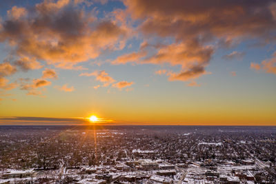Scenic view of sunset over city during winter