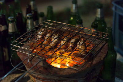 Close-up of prawns on barbecue grill