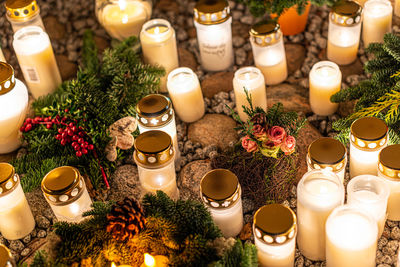 Grave candles on a cemetery on all saints eve
